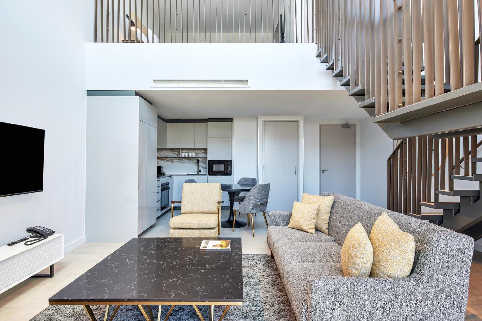 Meriton Suites Canberra Extérieur photo The interior of a duplex apartment